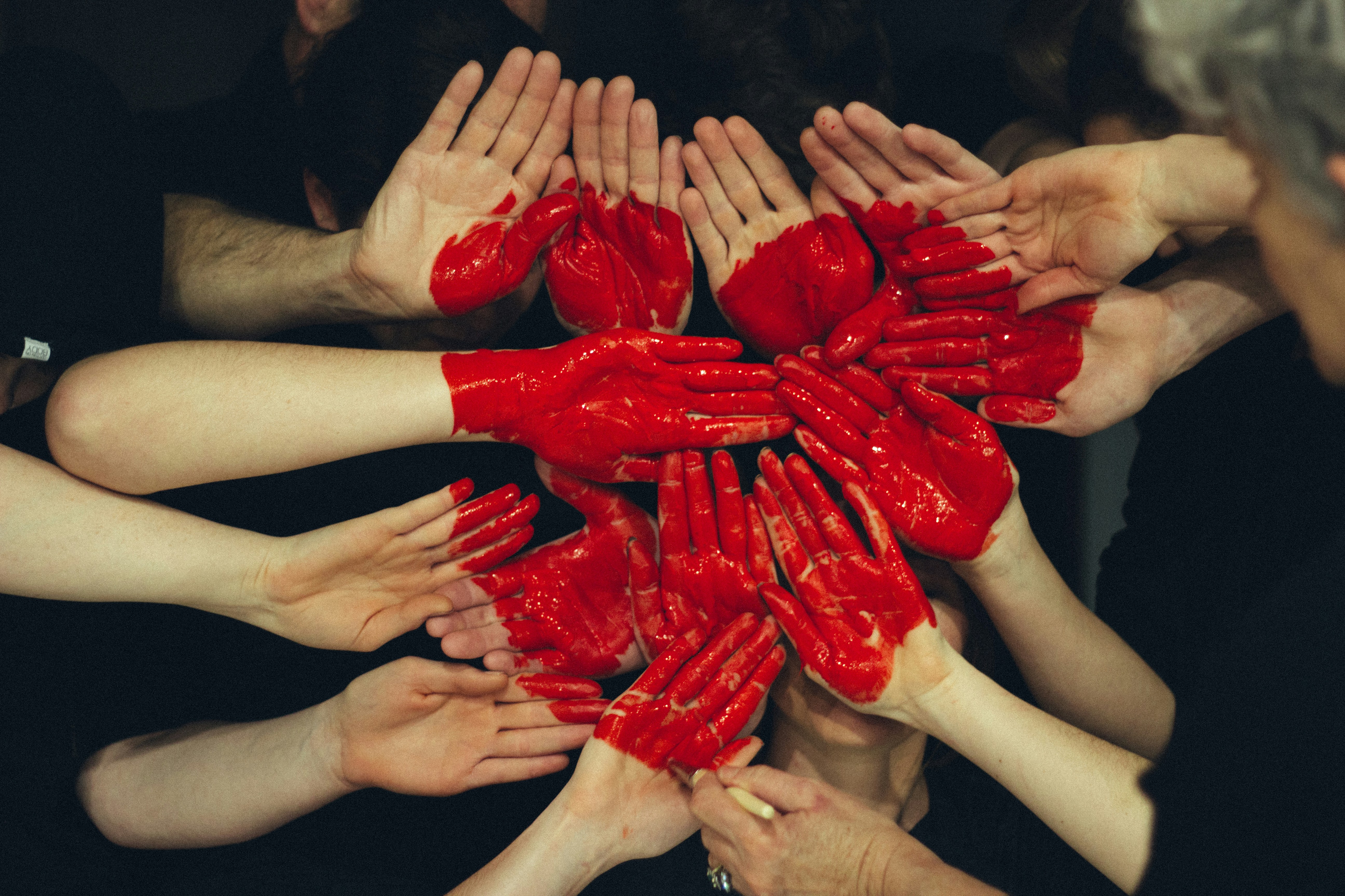 Volunteers joining hands in solidarity