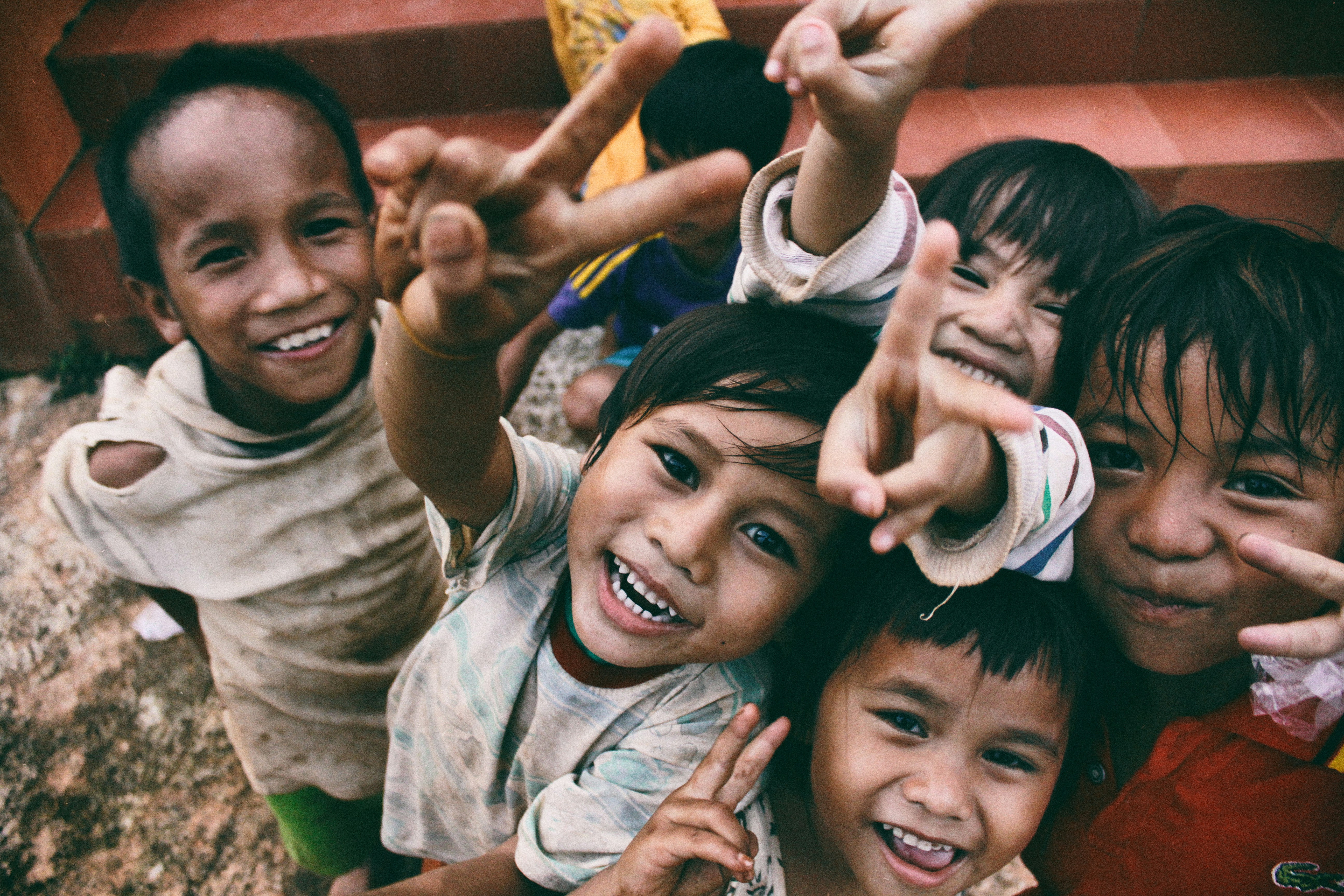Children smiling at a community outreach program